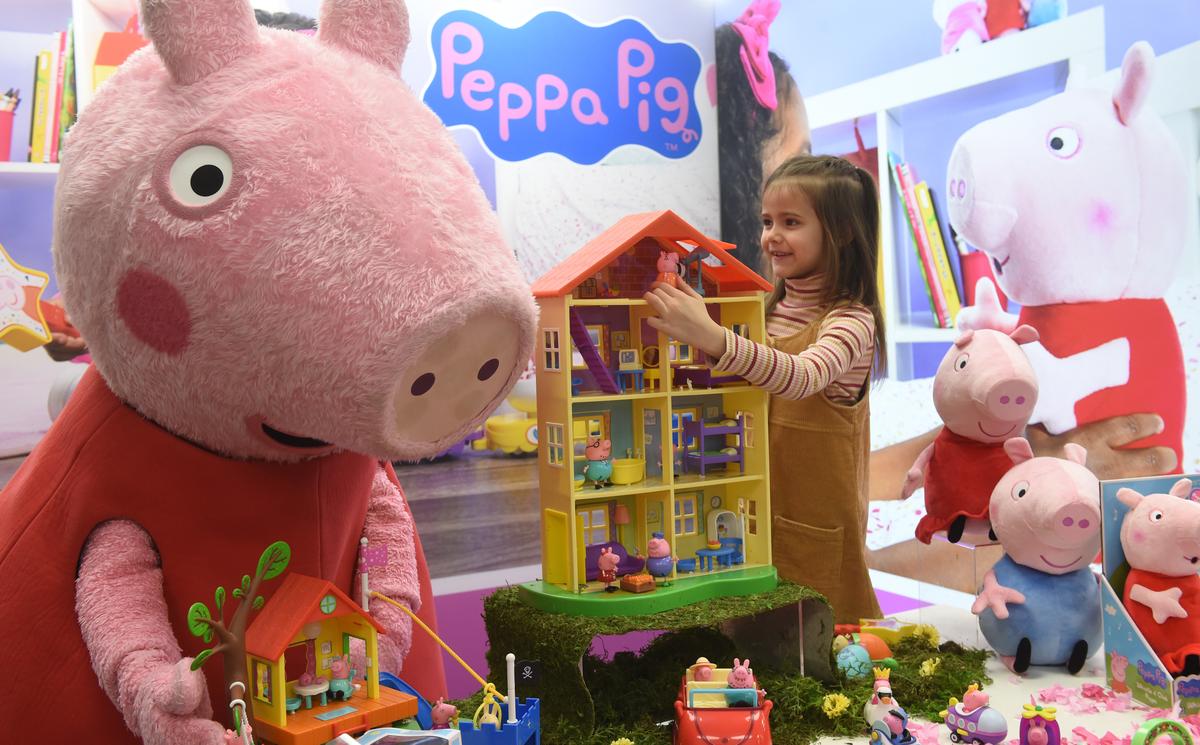 Young girl Daria plays with Peppa Pig toys during the press preview of the international toys fair in Germany, on Jan. 28, 2020. (CHRISTOF STACHE/AFP via Getty Images)