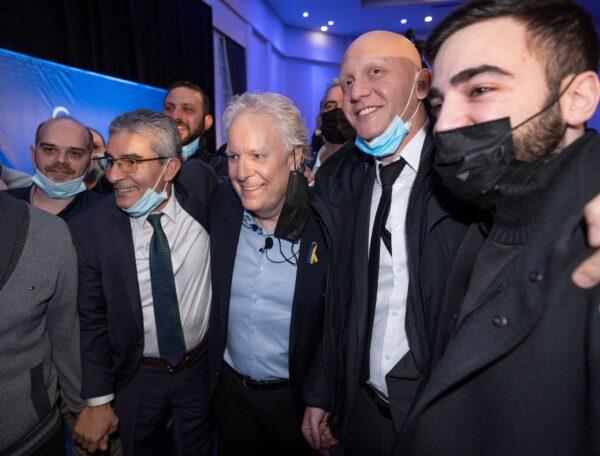 Jean Charest poses for pictures with supporters as he launches the Quebec part of his campaign for the Consevative Party leadership in Laval, Quebec, on March 24, 2022 (The Canadian Press/Ryan Remiorz)