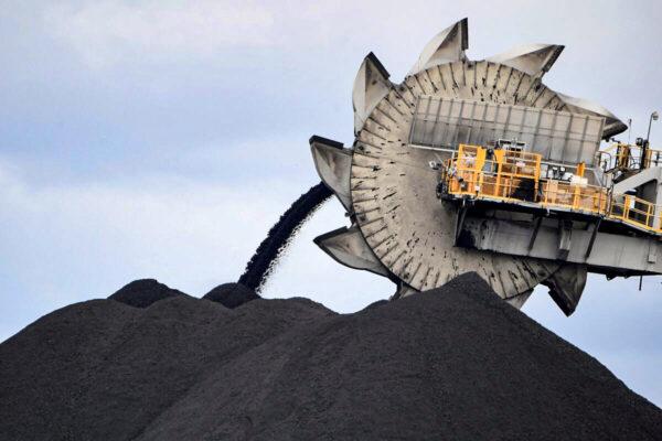A bucket-wheel dumping soil and sand is removed from another area of the mine in Newcastle, Australia, the world's largest coal exporting port, on Nov. 5, 2021. (Saeed Khan/AFP via Getty Images)