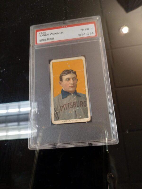 A 1909 T206 Sweet Caporal cigarette card of Pittsburgh Pirates shortstop Honus Wagner is considered the rarest baseball card by hobby enthusiasts. Here, one is pictured at a sports memorabilia show in Strongsville, Ohio, on March 27, 2022. The card sold for $3.1 million on March 31, 2022, at an auction by Colorado-based Mile High Card Co.. (Michael Sakal/The Epoch Times)