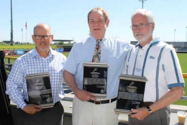 Three photographers for Topps who have taken thousands of pictures that have appeared on baseball cards: Gregg Forwerck (L), Ed Mailliard (C), and Doug McWilliams (R) following their induction into the Cactus League Hall of Fame in 2015. The trio was honored for their behind-the-scenes contributions to the history of spring training in Arizona. (Michael Sakal/The Epoch Times)