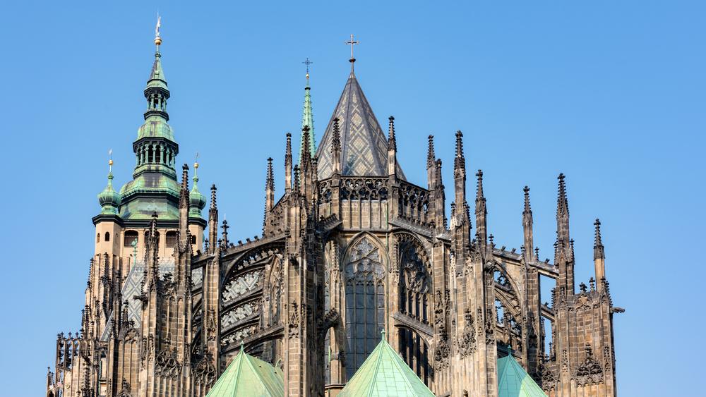 The flying buttresses, horizontal structures that extend from the main part of the church, support the vaulted ceiling. This allows for thinner walls and larger stained glass windows. The ornamental spires give weight and stability to the buttresses and offer a delicate quality to the architecture. (ABO Photography/Shutterstock)