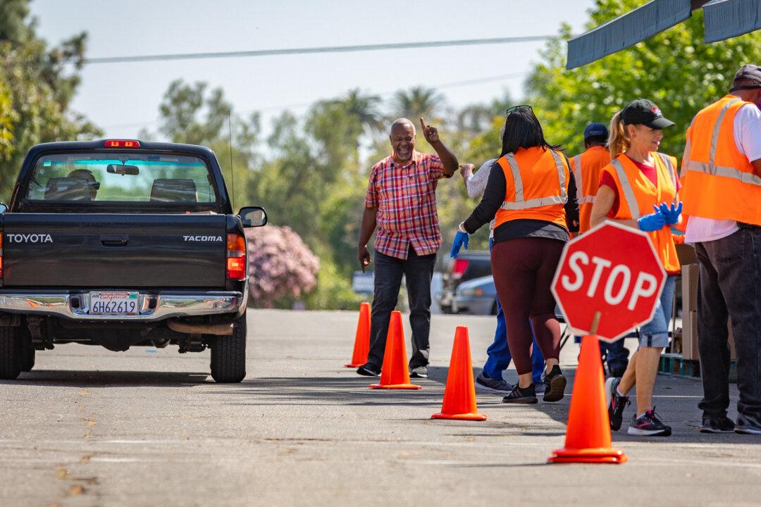 Volunteers Distribute Food Donations to the Hungry Each Tuesday in OC