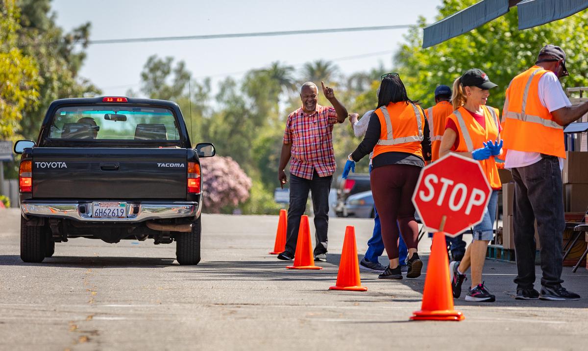 Volunteers Distribute Food Donations to the Hungry Each Tuesday in OC