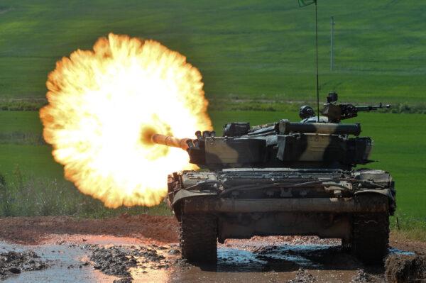 A Belarusian T-72 tank shoots at a target during a tank biathlon competition outside Minsk, Belarus, on June 17, 2017. (Maxim Malinovsky/AFP/Getty Images)