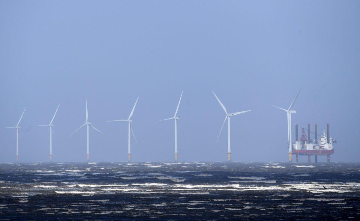 Waves break out at sea in front of Burbo Bank Offshore Wind Farm near New Brighton, at the mouth of the river Mersey in north-west England on March 13, 2019. (Paul Ellis/AFP via Getty Images)