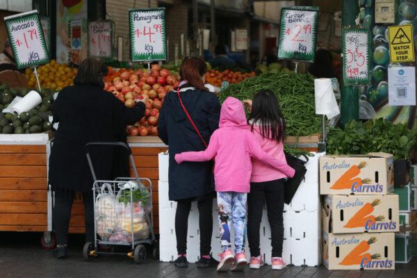 Shoppers gather to buy fruit and vegetables at a store in the suburb of Fairfield in Sydney, Australia, on July 9, 2021. (Lisa Maree Williams/Getty Images)