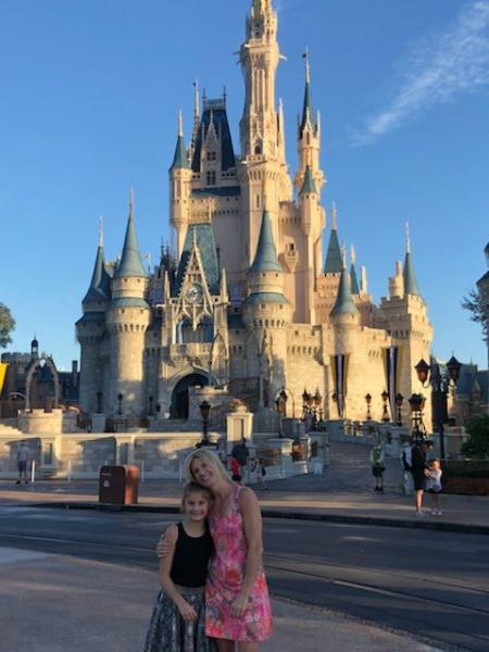 Michelle Depa and her daughter Allison pose in front of Cinderella's Castle at Disney's Magic Kingdom. (Courtesy of Michelle Depa)
