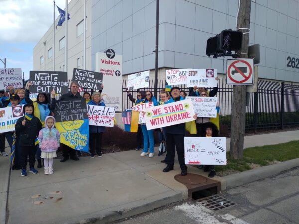 A group of about 30 people from northeast Ohio's Ukrainian community protested in front of a Nestle plant in Cleveland on April 7. (Michael Sakal/The Epoch Times)