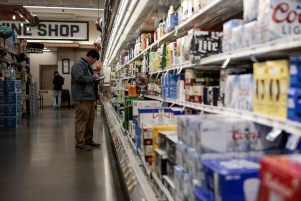 An employee surveys inventory in a Giant Food supermarket in Washington on Nov. 22, 2021. (Anna Moneymaker/file/Getty Images)