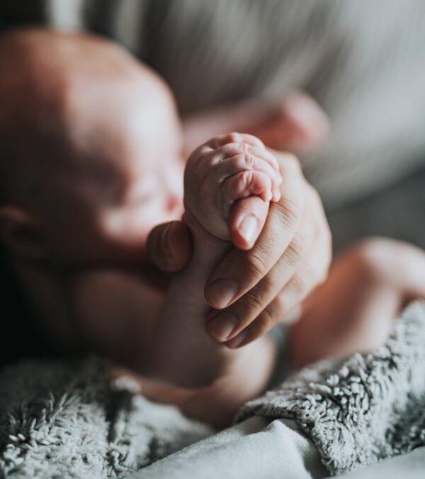 Infants develop motor skills quite quickly, from stabilizing their head, to eventually turning over. (Nathan Dumlao/Unsplash)