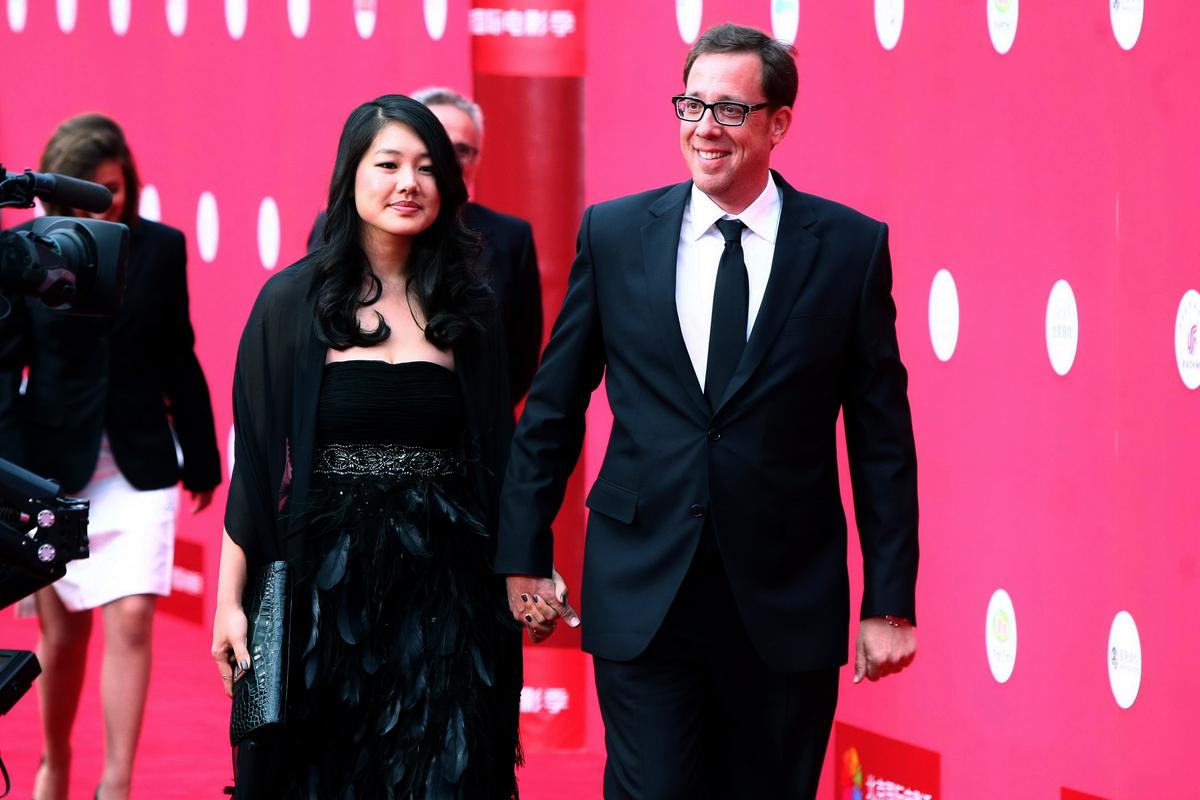 Film director Rob Minkoff (R) and his wife Crystal Kung Minkoff (L) arrive for the opening of the Beijing International Film Festival at the National Center for the Performing Arts in Beijing on April 23, 2011. (STR/AFP via Getty Images)