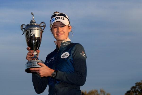 Nelly Korda poses with the trophy after winning the Pelican Women's Championship in a playoff at Pelican Golf Club, in Belleair, Fla., on Nov. 14, 2021. (Sam Greenwood/Getty Images)