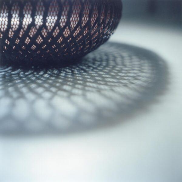 Noboru Fujinuma weaves or braids his bamboo baskets using traditional techniques. “Noboru Fujinuma, from 'The Ateliers of Wonders Series, 2020,'” by photographer Rinko Kawauchi. (Rinko Kawauchi/Michelangelo Foundation)