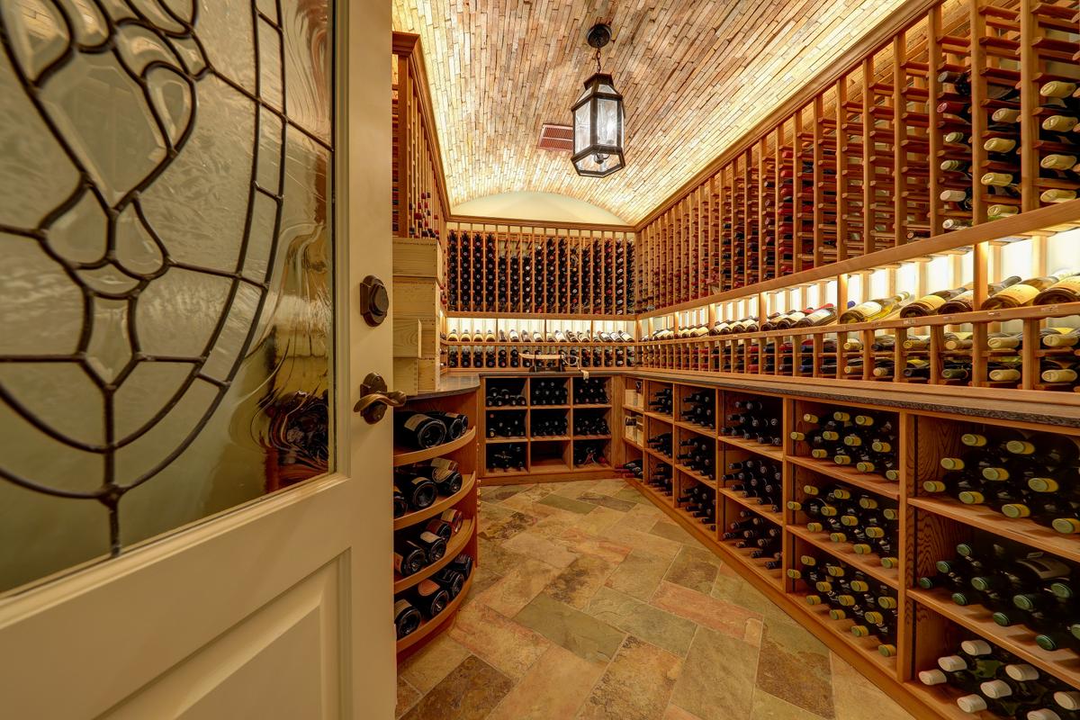 The home features a wine cellar capable of storing and displaying 1,800-plus bottles. A spa, a gym, and a media center are other notable amenities. (Courtesy of Jason Wells Photography and Golden Gate Creative/Tracy McLaughlin)