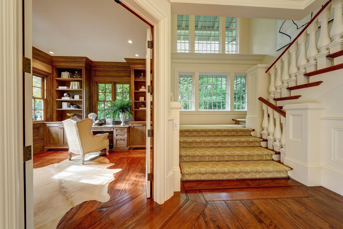 The main house features multiple sitting and study areas, living rooms, dining nooks, and formal spaces, as well as lavish private accommodations for the owners and guests on both levels of the home. (Courtesy of Jason Wells Photography and Golden Gate Creative/Tracy McLaughlin)