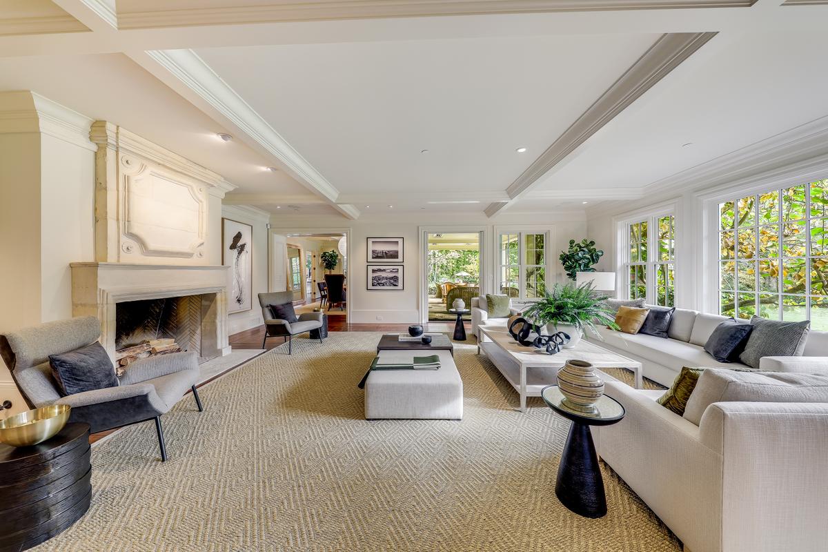 The open living room connects all the other spaces, and serves along with the gourmet kitchen as a hub for private life and entertaining. (Courtesy of Jason Wells Photography and Golden Gate Creative/Tracy McLaughlin)