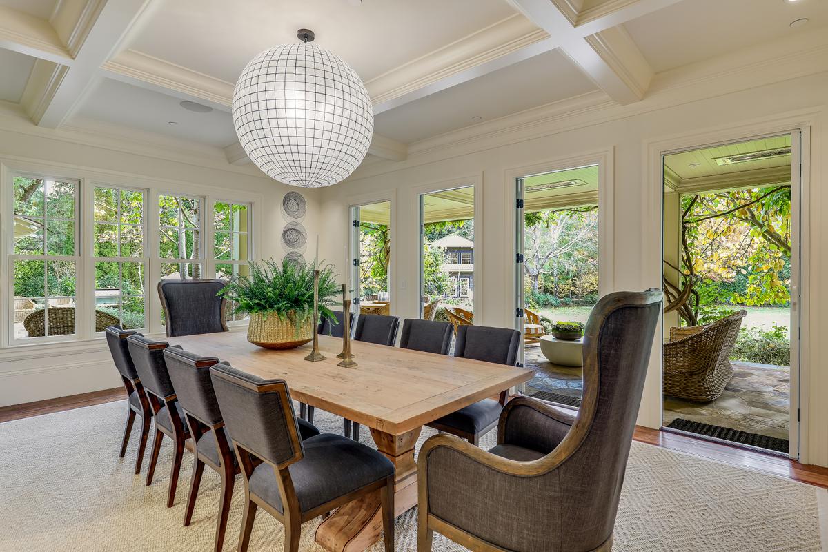 A formal dining room makes great use of ambient light and connects the residential wing to the outside terraces, the pool, and the gardens. (Courtesy of Jason Wells Photography and Golden Gate Creative/Tracy McLaughlin)