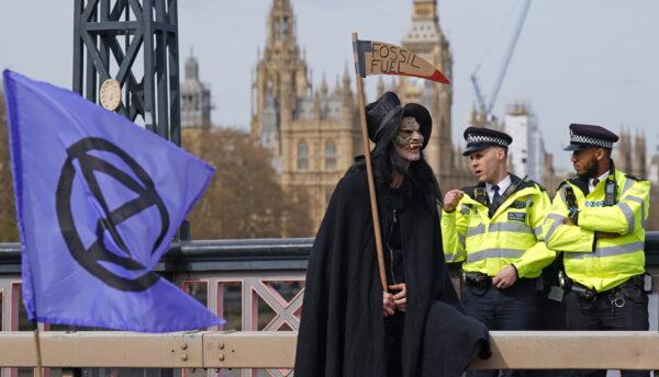 Activists from Extinction Rebellion blocking Lambeth Bridge in central London. (Yui Mok/PA)