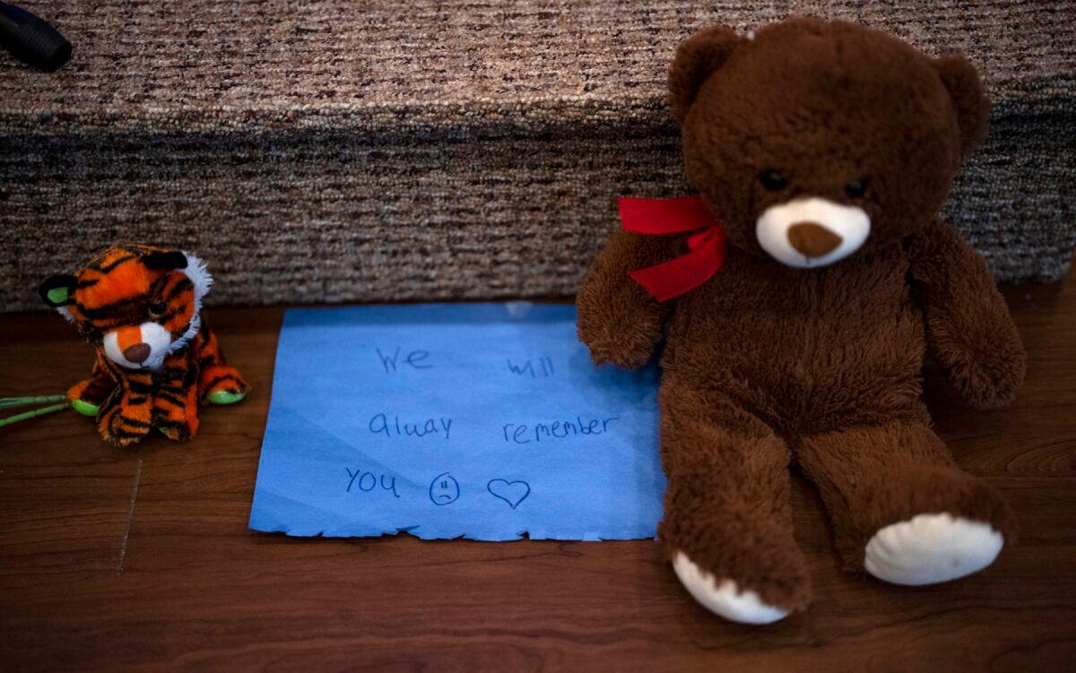 Stuffed animals are left at the altar during a prayer vigil for 10-year-old Iliana "Lily" Peters at Valley Vineyard Church in Chippewa Falls, Wis., on April 25, 2022. (Jeff Wheeler/Star Tribune via AP)