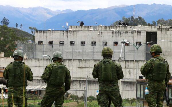 Soldiers stand guard outside Turi prison after a deadly prison riot in Cuenca, Ecuador, on April 3, 2022. (Marcelo Suquilanda/AP Photo)