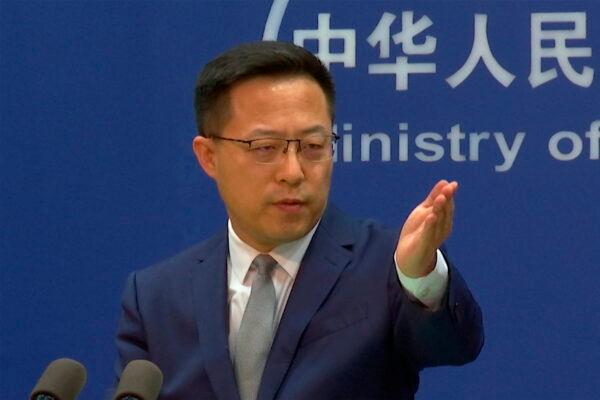 In this image made from video, Chinese Foreign Ministry spokesperson Zhao Lijian gestures during a media briefing that referred to reports of atrocities in the Ukrainian town of Bucha at the Ministry of Foreign Affairs office, in Beijing, on April 6, 2022. (AP Photo/Liu Zheng, File)