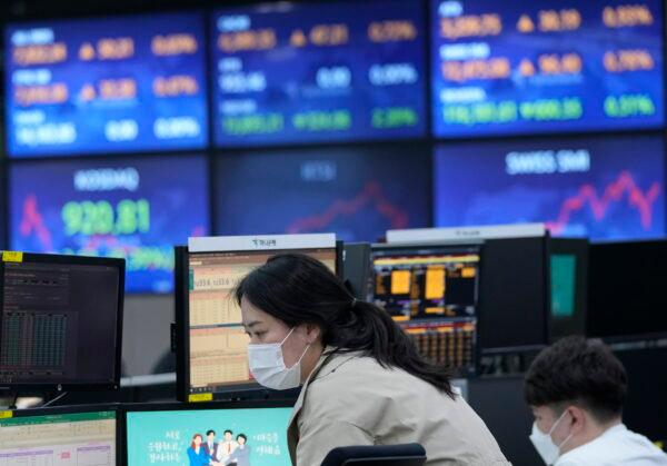 A currency trader watches monitors at the foreign exchange room of the KEB Hana Bank headquarters in Seoul, South Korea, on April 18, 2022.  (Ahn Young-joon/AP Photo)
