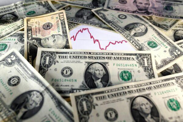 U.S. dollar notes in front of a stock graph in a picture illustration on Nov. 7, 2016. (Dado Ruvic/Illustration/Reuters)