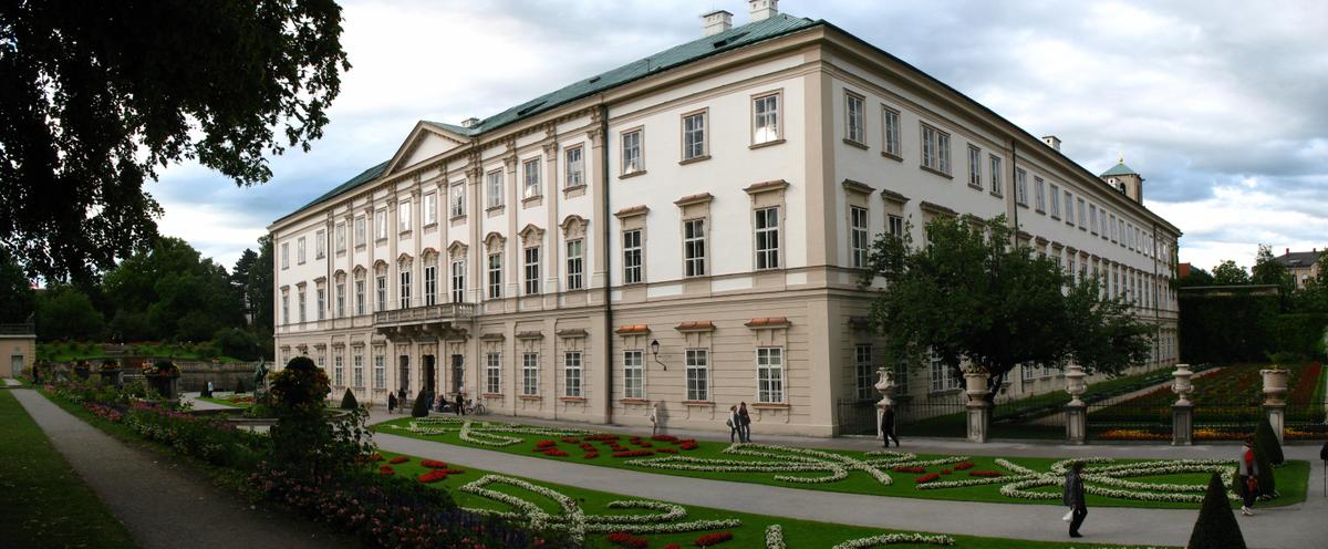 <span data-sheets-value="{"1":2,"2":"The symmetrical, Neoclassical structure of Mirabell Palace features subtle pilasters (imitating columns), a central pedimented frontispiece, a green-tiled roof characteristic of Salzburg, and central windows with rounded or pointed window hoods. The two tones of the façade nicely distinguish its levels which lighten as they climb and are tied together by accents around the windows, cornice, and pilasters. (Andrew Bossi/CC BY-SA 2.5)"}" data-sheets-userformat="{"2":15107,"3":{"1":0},"4":{"1":2,"2":10797812},"11":4,"12":0,"14":{"1":3,"3":1},"15":"Arial","16":10}" data-sheets-textstyleruns="{"1":0}{"1":266,"2":{"5":1}}{"1":273}">The symmetrical, Neoclassical structure of Mirabell Palace features subtle pilasters (imitating columns), a central pedimented frontispiece, a green-tiled roof characteristic of Salzburg, and central windows with rounded or pointed window hoods. The two tones of the façade nicely distinguish its levels which lighten as they climb and are tied together by accents around the windows, cornice, and pilasters. (Andrew Bossi/CC BY-SA 2.5)</span>