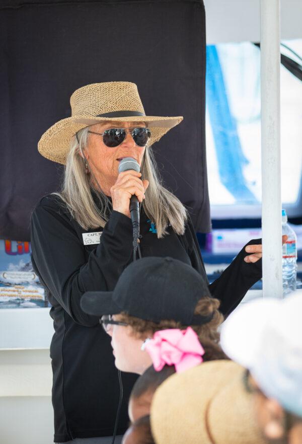 Boat Captain Marie Clark goes over rules with tourists on a whale watching trip in Dana Point, Calif., on April 8, 2022. (John Fredricks/The Epoch Times)