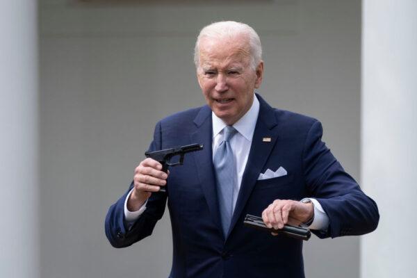 President Joe Biden holds up a ghost gun kit during an event in the Rose Garden of the White House in Washington on April 11, 2022. (Drew Angerer/Getty Images)