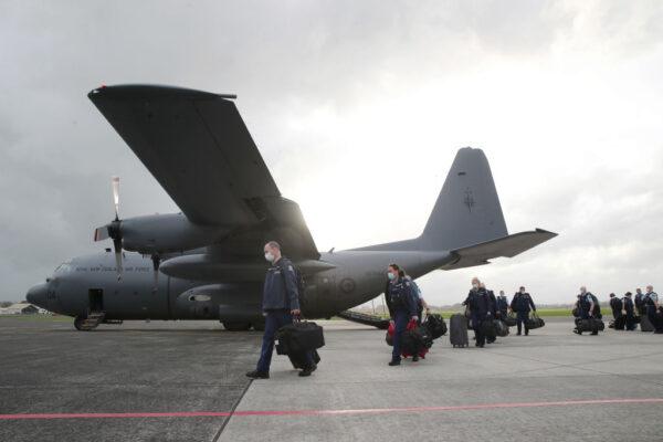 Police reinforcements from around the country arrive in the Royal New Zealand Air Force (RNZAF) C-130 Hercules in Hamilton, New Zealand, on Sept. 10, 2021. (Michael Bradley/Getty Images)