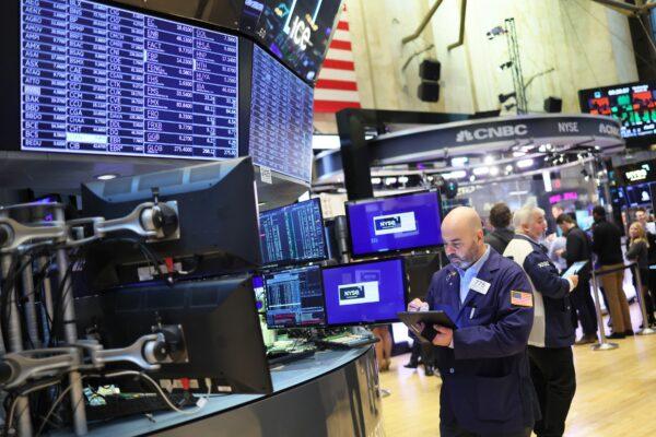 Traders work on the floor of the New York Stock Exchange in New York City on March 30, 2022. (Michael M. Santiago/Getty Images)