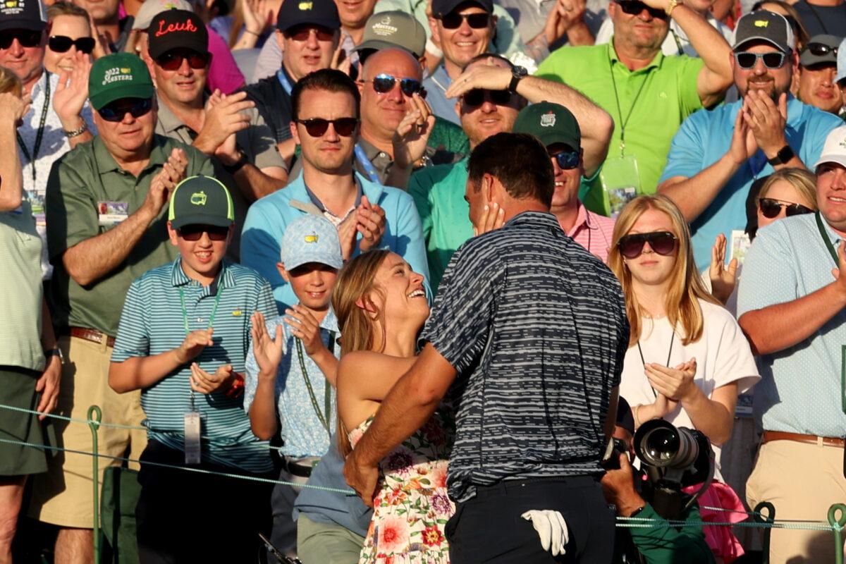 Scottie Scheffler and wife Meredith Scudder celebrate on the 18th green after Scheffler won the Masters at Augusta National Golf Club, in Augusta, Georgia, on April 10, 2022. (Jamie Squire/Getty Images)