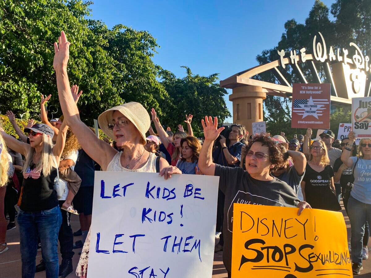 Protestors rally in opposition to The Walt Disney Company's stance against a recently passed Florida law outside of the company's headquarters in Burbank Calif., on April 6, 2022. (Jill McLaughlin/The Epoch Times)