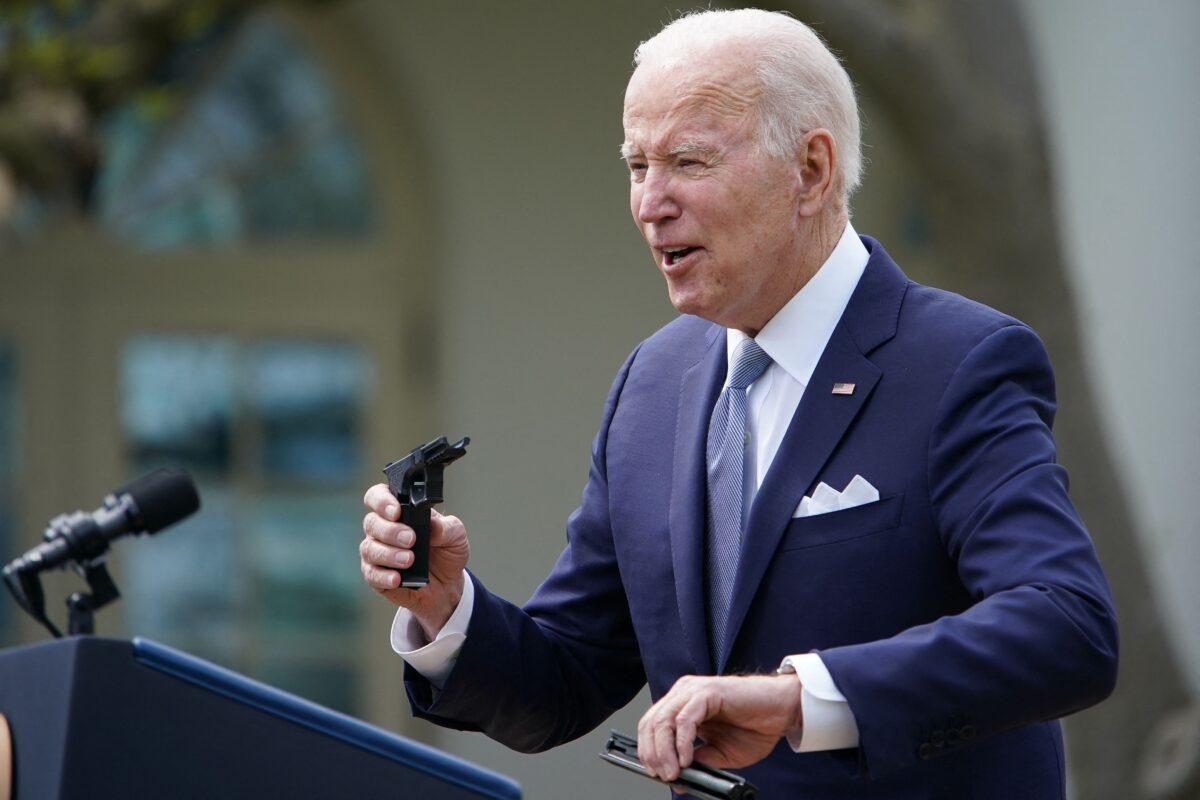 President Joe Biden holds up a ghost gun kit during an event at the White House in Washington on April 11, 2022. (Mandel Ngan/AFP via Getty Images)