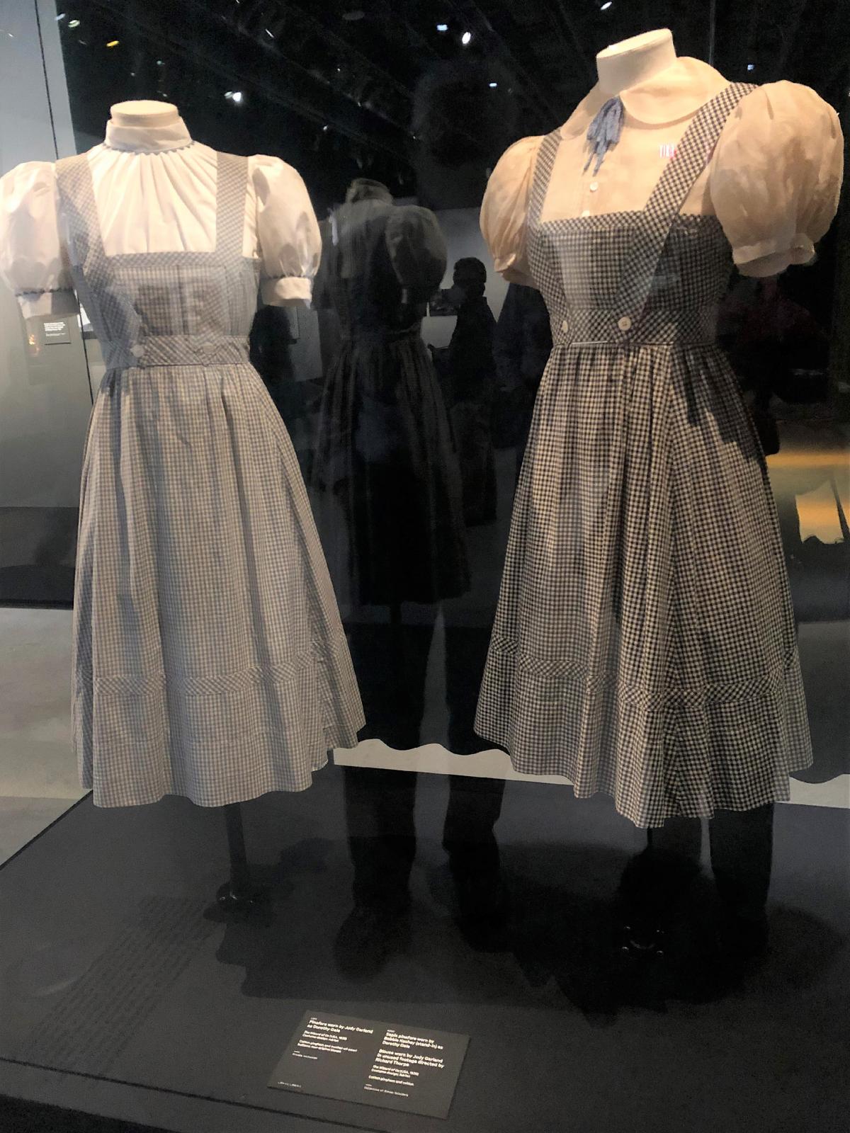 Dorothy's outfits from "The Wizard of Oz" are on display at the Academy Museum of Motion Pictures Arts and Sciences in Los Angeles. (Bill Neely)