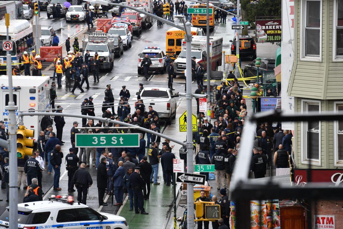 Members of the New York Police Department and emergency vehicles crowd the streets after at least 13 people were injured during a rush-hour shooting at a subway station in the New York borough of Brooklyn, on April 12, 2022. (Angela Weiss/AFP via Getty Images)