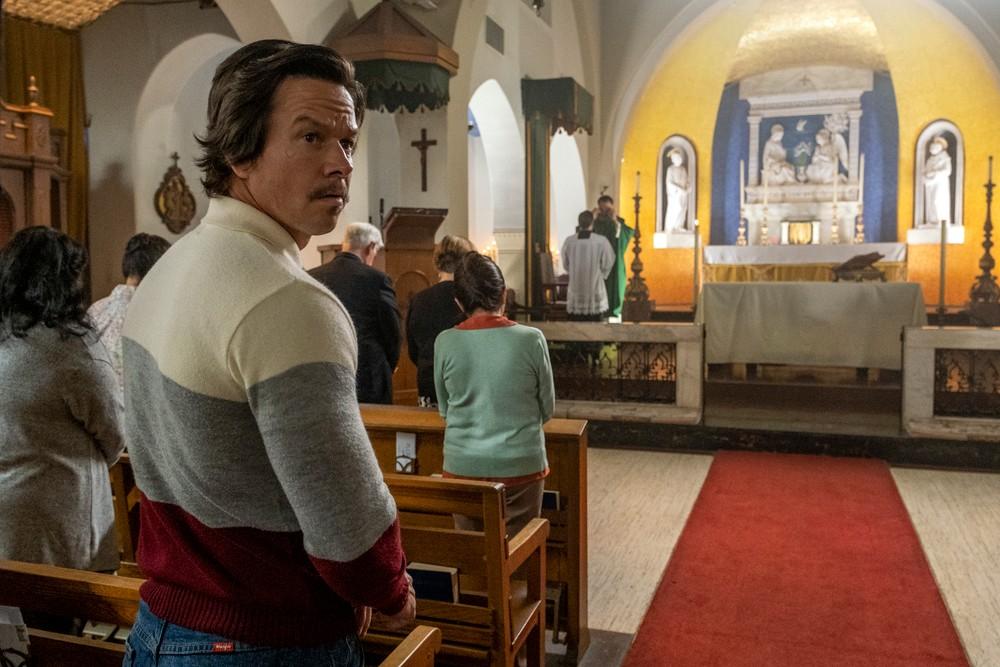 Stuart Long (Mark Wahlberg) is a fish out of water when he starts going to church for the sole purpose of winning Carmen's approval, in "Father Stu." (Columbia Pictures/Sony Pictures Releasing)