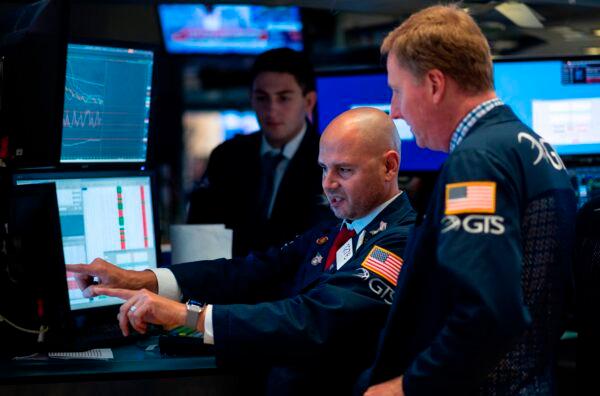 Traders work before the closing bell at the New York Stock Exchange (NYSE) on August 14, 2019 in New York City. (Johannes Eisele/AFP via Getty Images)