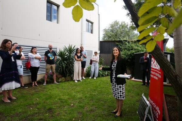 Auctioneer Karen Harvey counts down a bid during an auction of residential property in Hurlstone Park in Sydney, Australia, on May 8, 2021. (Lisa Maree Williams/Getty Images)
