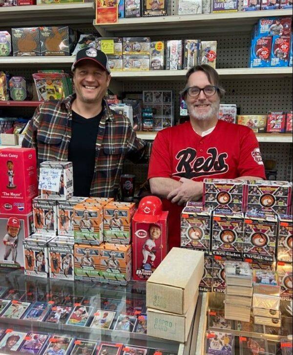 Mike Siska (L) and Doug Heflin (R) of Ideal Baseball Cards a sports memorabilia shop in Cincinnati were deluged with fans and collectors coming into the shop on April 12. That day was the home opener for the Cincinnati Reds, and the fans in that region remain passionate about collecting sports cards. (Photo courtesy Mike Siska)