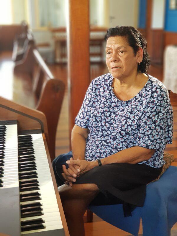 June Pearson sits at the organ inside St John's Lutheran Church in Hope Vale, Australia. (Courtesy of Caden Pearson)