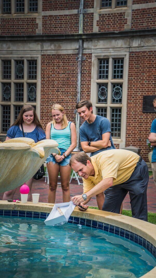 Assistant Professor of Naval Architecture Bradley Golden (foreground) with students.