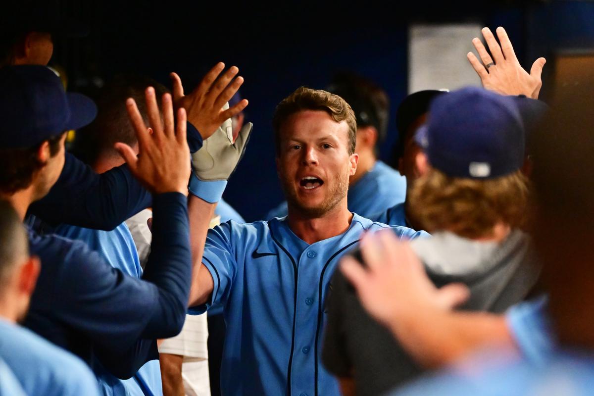 Brett Phillips #35 of the Tampa Bay Rays celebrates with teammates after hitting a home run in the third inning against the Oakland Athletics at Tropicana Field, in St. Petersburg, Fla., on April 12, 2022. (Julio Aguilar/Getty Images)