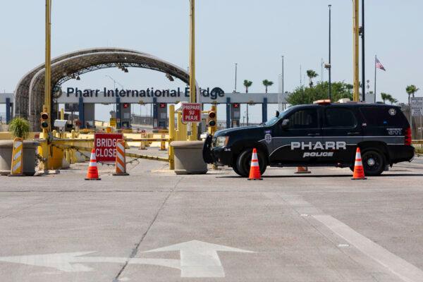 Police officers block the entrance to the Pharr-Reynosa International Bridge in Pharr, Texas, on April 13, 2022. Mexican truckers have suspended traffic since at least April 9 in protest of Texas Gov. Abbott’s new inspections. (Michael Gonzalez/Getty Images)