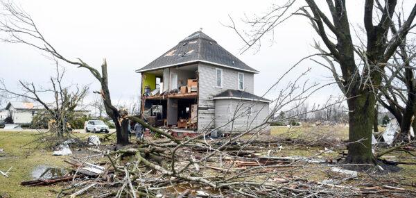 A house had its entire east side stripped away by the storms in Taopi, Minn., on April 13, 2022. (Eric Johnson/The Daily Herald via AP)