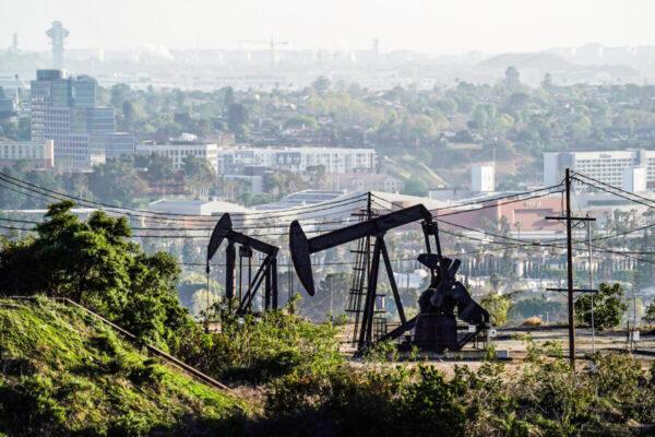 Active pumpjacks from oil wells are pictured at the Inglewood Oil Field, the largest urban oil field in the United States, from the Baldwin Hills Scenic Overlook in Culver City, Calif., on March 10, 2022. (Bing Guan/Reuters)