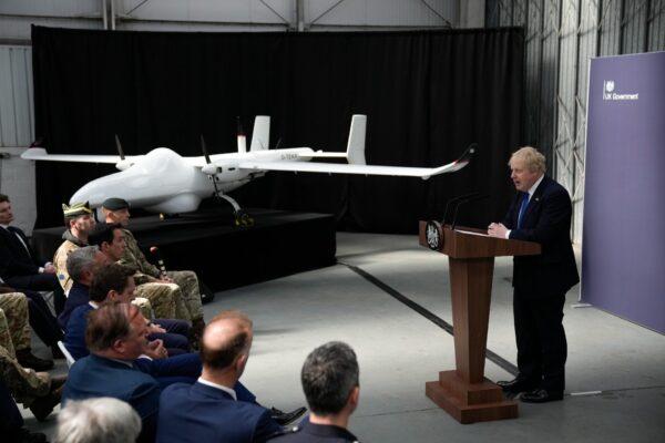 Prime Minister Boris Johnson delivers a speech at Lydd Airport in Dover, England, on April 14, 2022. (Matt Dunham - WPA Pool/Getty Images)
