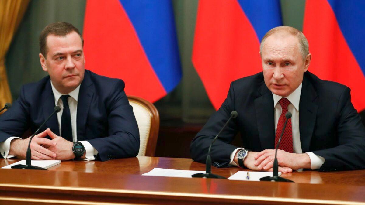 Russian President Vladimir Putin (R) and deputy security council chief Dmitry Medvedev meet with members of the government in Moscow, Russia, on Jan. 15, 2020. (Dimitry Astakhov/SPUTNIK/AFP via Getty Images)